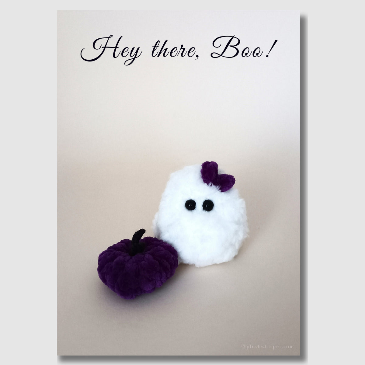 Aesthetic Halloween digital download card featuring the phrase Hey There Boo in elegant dark purple cursive. Shows a handmade plush white ghost and a soft purple velvet pumpkin decoration.