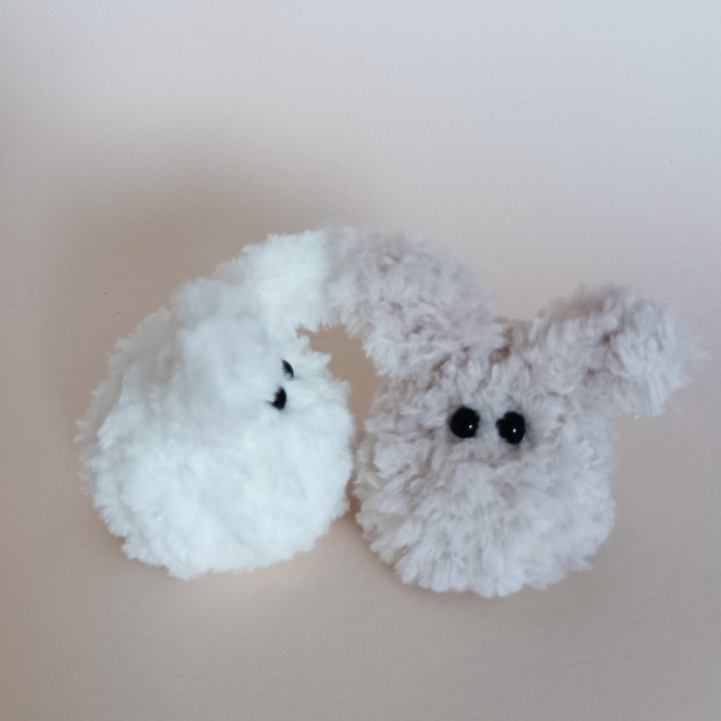 A pair of miniature handmade fuzzy bunny plush desk pets in solid white and heather grey colors standing together. Soft pocket sized pocket pets variation overview and cute aesthetic home office companion pack.